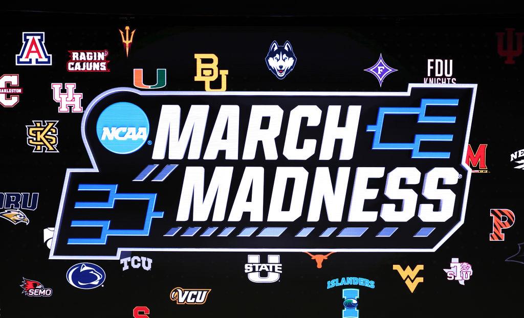 SACRAMENTO, CALIFORNIA - MARCH 16: A detailed view of the March Madness logo is seen prior to the first round game between the Utah State Aggies and the Missouri Tigers in the NCAA Men's Basketball Tournament at Golden 1 Center on March 16, 2023 in Sacramento, California. (Photo by Ezra Shaw/Getty Images)