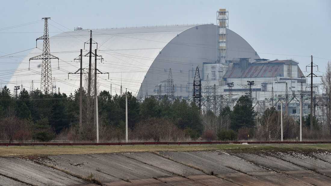 A picture taken on April 13, 2021 shows the giant protective dome built over the sarcophagus covering the destroyed fourth reactor of the Chernobyl Nuclear Power Plant ahead of the upcoming 35th anniversary of the Chernobyl nuclear disaster. (Photo by Sergei SUPINSKY / AFP) (Photo by SERGEI SUPINSKY/AFP via Getty Images)