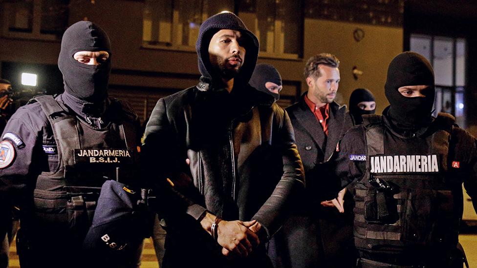 Andrew Tate and Tristan Tate are escorted by police officers outside the headquarters of the Directorate for Investigating Organized Crime and Terrorism in Bucharest (DIICOT) after being detained for 24 hours, in Bucharest, Romania, December 29, 2022.  Inquam Photos/Octav Ganea via REUTERS ATTENTION EDITORS - THIS IMAGE WAS PROVIDED BY A THIRD PARTY. ROMANIA OUT. NO COMMERCIAL OR EDITORIAL SALES IN ROMANIA